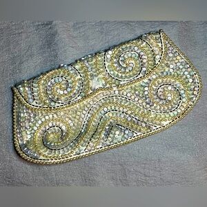 1960s vintage hand beaded clutch, metal clasps.